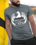Mother Of Cats Dragon Style Graphic T Shirt Funny Cat Lover Tee - model wearing grey tee, leaning on column