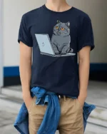 Funny Cat Working On Laptop Graphic T Shirt Cute Tech Kitty Tee - model wearing navy tee with hands in pockets