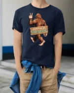 Dont Be An Assquatch Funny Bigfoot Graphic T Shirt Humor Style Tee - model wearing navy tee with hands in pockets