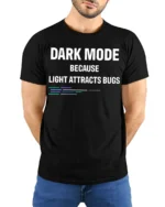 Dark Mode Because Light Attracts Bugs Funny Coding T Shirt Geek Tee - model wearing black tee with hands behind back