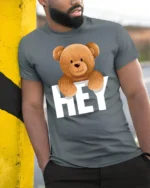 Cute Teddy Bear Hey Graphic T Shirt Funny Cartoon Animal Tee - model wearing grey tee, leaning on column