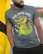 Cool Gator Vibes Funny Alligator Graphic T Shirt Cute Animal Tee - model wearing grey tee, leaning on column