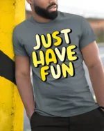 Just Have Fun Positive Quote Graphic T Shirt Happy Vibes Tee - model wearing grey tee, leaning on column
