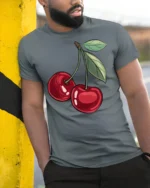 Sweet Red Cherry Fruit Graphic T Shirt Cute Aesthetic Summer Tee - model wearing grey tee, leaning on column
