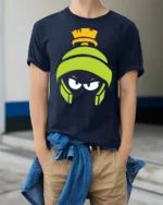 Martian Alien Cartoon Angry Face Funny Graphic T Shirt - model wearing navy tee with hands in pockets