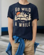 Go Wild For A While Vintage Nature Adventure T Shirt - model wearing navy tee with hands in pockets