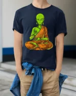 Alien Buddha Meditation Funny Spiritual Graphic T Shirt - model wearing navy tee with hands in pockets