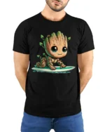 Cute Tree Baby Surfing Cartoon Graphic T Shirt - model wearing black tee with hands behind back
