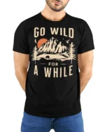 Go Wild For A While Vintage Nature Adventure T Shirt - model wearing black tee with hands behind back