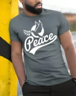 Peace Dove Symbol Positive Message Graphic T Shirt - model wearing grey tee, leaning on column