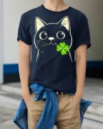Adorable Black Cat Clover Lucky Charm Cartoon T Shirt - model wearing navy tee with hands in pockets