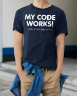 My Code Works I Have No Idea Why Funny Dev T Shirt - model wearing navy tee with hands in pockets