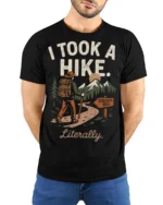 Retro Hiking Joke I Took A Hike Literally Nature Graphic Tee - model wearing black tee with hands behind back