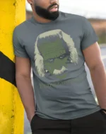 FrankEinstein Funny Scientist Monster Mashup Graphic T Shirt - model wearing grey tee, leaning on column