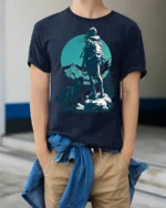 Lone Hiker With Wolf Mountain Adventure Nature Graphic Tee - model wearing navy tee with hands in pockets