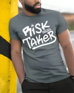 Risk Taker Bold Street Style Motivational Graphic Tee - model wearing grey tee, leaning on column