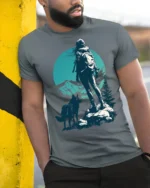 Lone Hiker With Wolf Mountain Adventure Nature Graphic Tee - model wearing grey tee, leaning on column