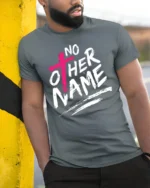 No Other Name Jesus Cross Bold Christian Graphic T Shirt - model wearing grey tee, leaning on column