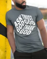 Ask Trust God Thank God Christian Faith Typography Tee - model wearing grey tee, leaning on column