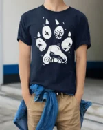 Artistic Animal Paw Print Graphic T Shirt Nature Lover Tee - model wearing navy tee with hands in pockets