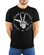 Come In Peace Or Leave In Pieces Skull Hand Graphic T Shirt - model wearing black tee with hands behind back