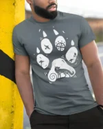 Artistic Animal Paw Print Graphic T Shirt Nature Lover Tee - model wearing grey tee, leaning on column