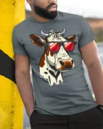 Funny Cool Cow With Sunglasses Graphic T Shirt Farm Humor Tee - model wearing grey tee, leaning on column