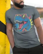 Cool T Rex Dinosaur Sunglasses Lightning Graphic T Shirt Tee - model wearing grey tee, leaning on column