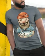 Bearded Angler Sailor Fish Catch Graphic Tee Design - model wearing grey tee, leaning on column