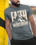 Faith Can Move Mountains Inspirational Graphic T Shirt - model wearing grey tee, leaning on column