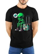 Funny Traveling Alien With Suitcase Graphic T Shirt Space Humor - model wearing black tee with hands behind back
