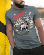 Funny Goat Obey I Eat Orders Graphic T Shirt Sarcastic Humor - model wearing grey tee, leaning on column