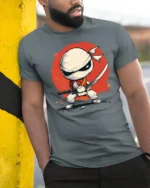 Cartoon Ninja Fighter Graphic T Shirt Cute Warrior Style Design - model wearing grey tee, leaning on column