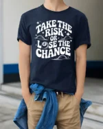 Take The Risk Or Lose The Chance Motivational Quote T Shirt - model wearing navy tee with hands in pockets