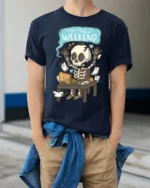 Yay Finally Weekend Funny Skeleton Work Humor Graphic T Shirt - model wearing navy tee with hands in pockets