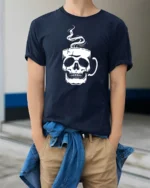 Cool Skull Coffee Lover Graphic T Shirt Minimalist Design - model wearing navy tee with hands in pockets