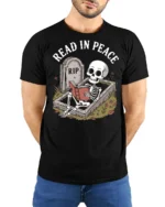 Funny Read In Peace Skeleton Graphic T Shirt Book Lover Humor - model wearing black tee with hands behind back
