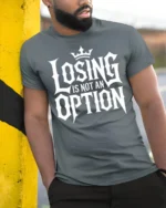 Losing Is Not An Option Motivational Bold Typography T Shirt - model wearing grey tee, leaning on column