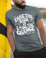 Take The Risk Or Lose The Chance Motivational Quote T Shirt - model wearing grey tee, leaning on column