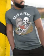 Funny Read In Peace Skeleton Graphic T Shirt Book Lover Humor - model wearing grey tee, leaning on column
