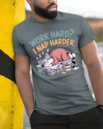 Funny Work Hard Nap Harder Cat Graphic T Shirt Lazy Humor - model wearing grey tee, leaning on column