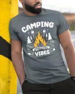 Camping Vibes Campfire Graphic T Shirt Outdoor Adventure Tee - model wearing grey tee, leaning on column