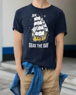 Seas The Day Pirate Ship Graphic Tee Funny Sailing Tshirt - model wearing navy tee with hands in pockets