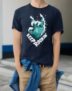 Keep Rocking Wave Graphic Tee Cool Ocean Music Tshirt - model wearing navy tee with hands in pockets