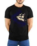 Cosmic Sailing Ship Graphic Tee Space Ocean Fantasy Tshirt - model wearing black tee with hands behind back