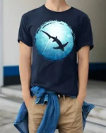 Shark Ocean Silhouette Graphic Tee Marine Life Art Tshirt - model wearing navy tee with hands in pockets