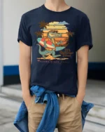 Funny Summer Crocodile Surf Graphic Tee Beach Vibes Tshirt - model wearing navy tee with hands in pockets