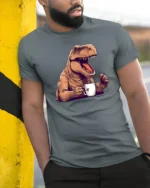 Funny T Rex Coffee Graphic Tee Dinosaur Lover Humor Tshirt - model wearing grey tee, leaning on column