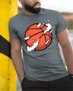 Cool Basketball Graphic Tee Sport Style Urban Game Tshirt - model wearing grey tee, leaning on column