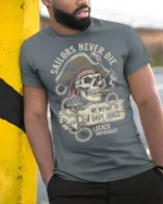 Sailors Never Die Pirate Skull Graphic Tee Vintage Tshirt - model wearing grey tee, leaning on column